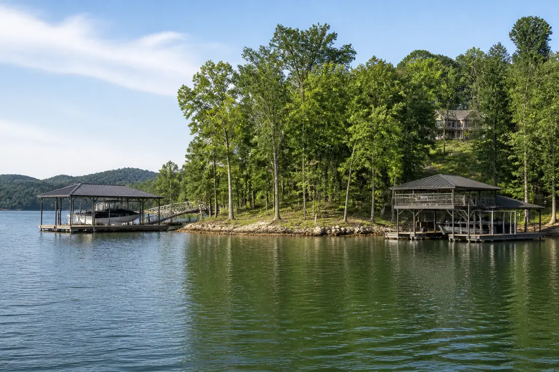 Two neighboring docks on the same stretch of reservoir shoreline